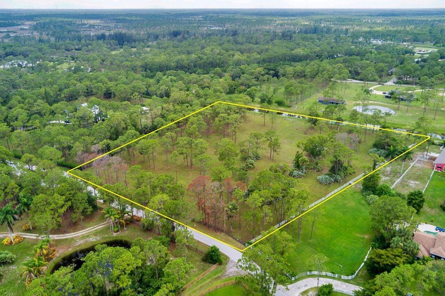 This Property Is That Special Property You Have Been Looking For! Property Has Been Cleared, Fenced And Is Ready For Your Custom Home! Parklike Setting Offers Peace And Tranquility That You Have Been Looking For! Closest Location To The Equestrian Park Of Caloosa! Don't Wait This One Of A Kind Property In This Special Community Will Not Last! The wonderful community of Caloosa is an equestrian community that consists of 350 five acre home sites in Palm Beach Gardens. Fifteen minutes to Fla. Turnpike, 95 and the Gardens mall. Twenty five minutes to downtown West Palm Beach & Palm Beach International Airport. Caloosa's 32 acre horse park makes this neighborhood a real estate gem in Palm Beach County with over 30 miles of interior horse trails.
