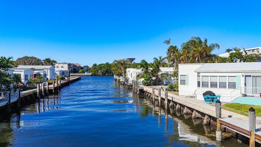 This is an exceptional property. A 1994 double wide unit in pristine condition along the canal with 46 shares. There is no existing dock but there are pylons in place for one. Large open living spaces with magnificent views. 1032+/- square feet of living space, two bathrooms and laundry in the unit. Mallard Drive is the northern most street in Briny and is a dead end. A/C is new. Enjoy your private beach, heated pool, all the clubs.