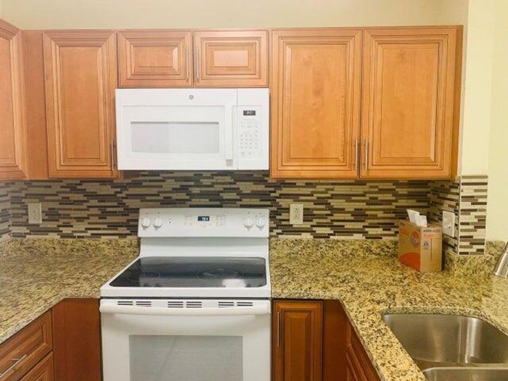 Photo of 880 Summit Lake Drive, West Palm Beach, FL 33406 (MLS # R10959722)