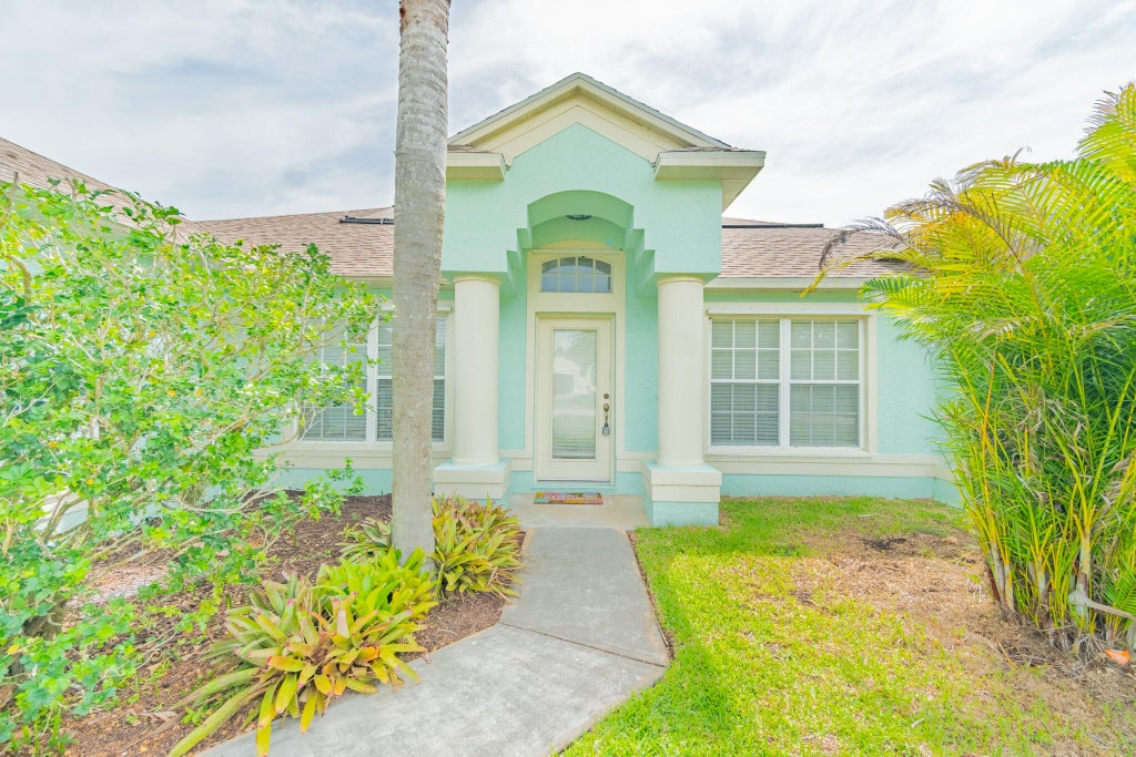 Photo of 5593 NW WESLEY Road, Port Saint Lucie, FL 34986 (MLS # B26071336)