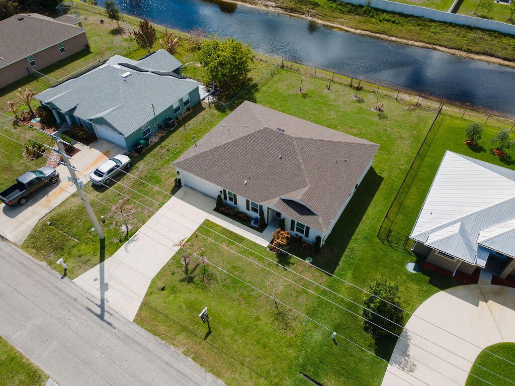 Photo of 138 SW Carter Avenue, Port Saint Lucie, FL 34983 (MLS # B26005559)
