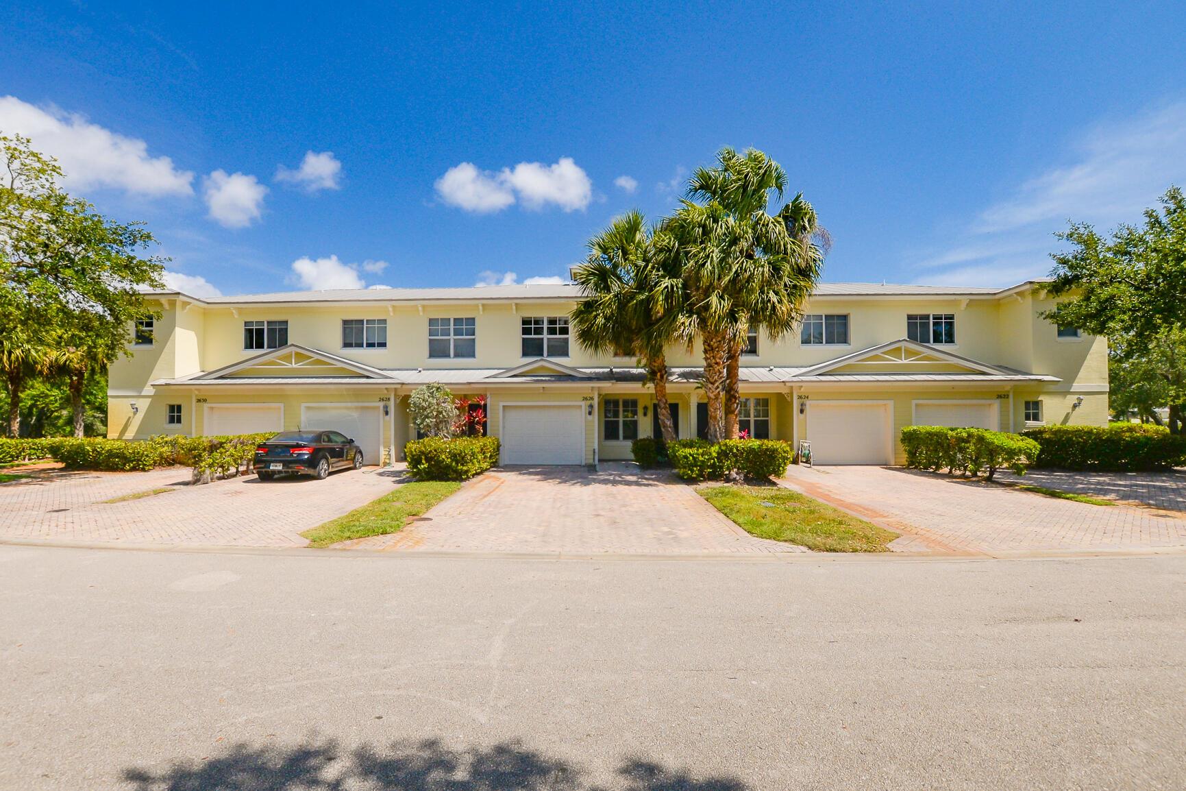 Spacious two-story 4/2.5/1 townhome in River Oaks with just under 2,000 square feet of living space. This home features a large great room downstairs with tile and vinyl flooring throughout. The kitchen boasts an extended 4-seat breakfast counter, stone countertops, and stainless steel appliances. The master suite offers a private balcony and an en-suite bathroom with a double vanity, separate shower, and soaking tub. River Oaks townhomes feature metal roofs, well-maintained landscaping, green spaces, streetlights throughout, and each home includes a brick paver driveway. Enjoy the lovely community pool and clubhouse nestled under mature oak trees. Conveniently located minutes from US-1, downtown Fort Pierce, beaches, parks, schools, and shopping!