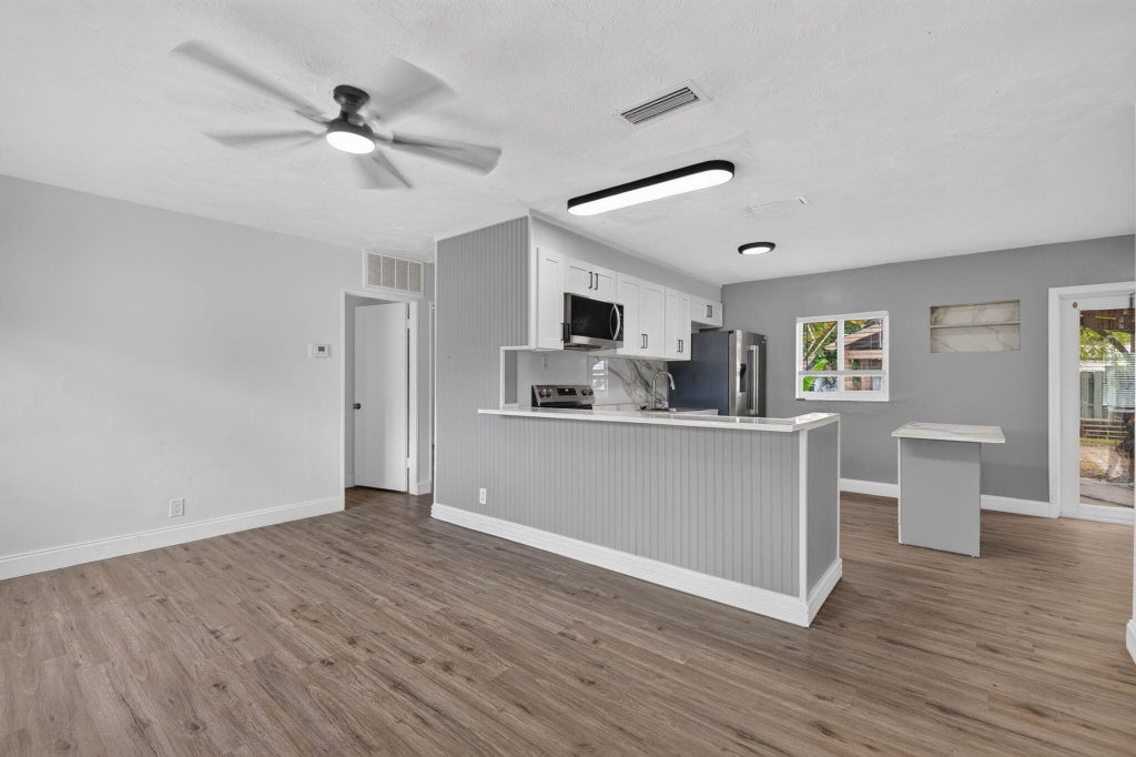 Photo of 540 NE 61st Street, Oakland Park, FL 33334 (MLS # B26044906)