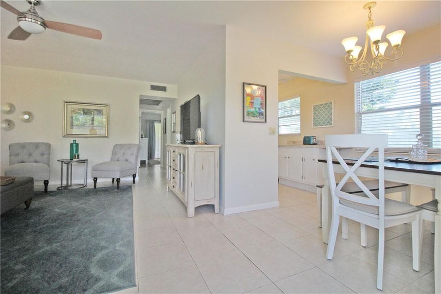 CORNER UNIT, 2ND FLOOR WITH A LIFT!! YOU WON'T WANT TO MISS THIS IMMACULATE 2 BDRM, 1.5 BTH CONDO! FURNISHED & READY TO MOVE IN, THIS UNIT FEATURES A BRAND NEW A/C & HOT WATER HEATER! KITCHEN HAS WHITE APPLIANCES, TILE COUNTERTOP & BACKSPLASH & EXTRA CABINET & COUNTER SPACE!  NO DOME HERE! CERAMIC TILE IN LIV AREAS & LAM WOOD FLRS. IN BDRMS! CEILING FANS IN EVERY ROOM!! NO POPCORN CEILINGS! BOTH BEDROOMS HAVE SLIDING GLASS DOORS TO THE ENCLOSED PATIO WITH A LOVELY SERENE GARDEN VIEW! CONVENIENTLY LOCATED CLOSE TO EAST GATE & SHORT WALK TO POOL & TENNIS COURTS! THIS 55+ ADULT COMMUNITY HAS FREE TRANSPORTATION INSIDE & OUT! THE AMENITIES INCLUDE A LAVISH CLUBHOUSE W/A 1500 SEAT THEATER, STATE OF THE ART GYM, TENNIS, INDOOR/OUTDOOR POOLS, MANY CLASSES & SO MUCH MORE!! ASSOCIATION CLAIMS 55+!!