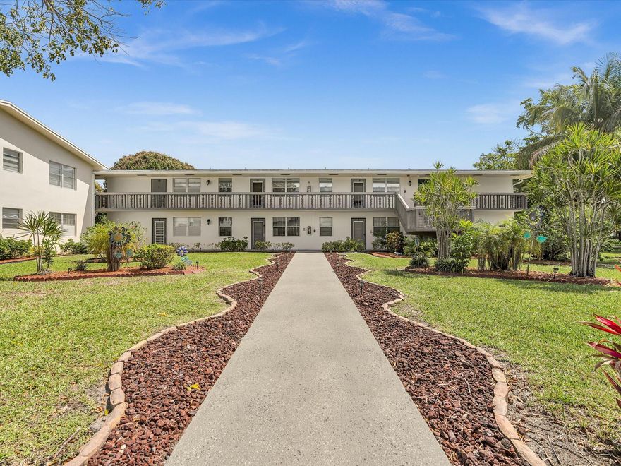 CENTURY VILLAGE, a vibrant 55+gated community offering resort-style living at a low cost.  This is a well-maintained corner unit filled with natural light due to its desirable end-unit location.  This spacious layout features an open living and dining area, a generously sized bedroom with ample closet space, and an additional 1/2 bath for guests.  Walk out your front door and enjoy peaceful garden views.  The unit has a functional kitchen layout, neutral finishes, and is ready for your personal touch, immediate enjoyment, or a great investment.  Century village is known for its exceptional amenities, including clubhouse, pools, tennis and pickleball, theater, courtesy transportation, and a full calendar of social events.  Seasonal or annual, make this your home! AC-2025, Oven-2025, Electric-2022 SHOWINGTIME, call the listing agent. 732-664-3706.  Lockbox