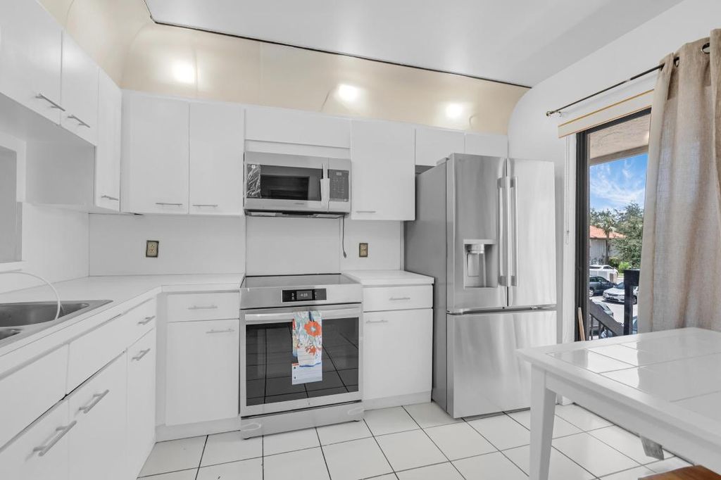 Photo of 300 E Club Circle #203, Boca Raton, FL 33487 (MLS # R11093644)