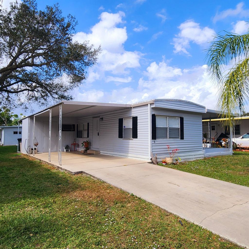 Photo of 5 Espanola Lane, Port Saint Lucie, FL 34952 (MLS # R11058400)