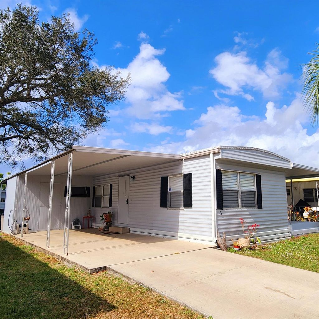 Photo of 5 Espanola Lane, Port Saint Lucie, FL 34952 (MLS # R11058400)