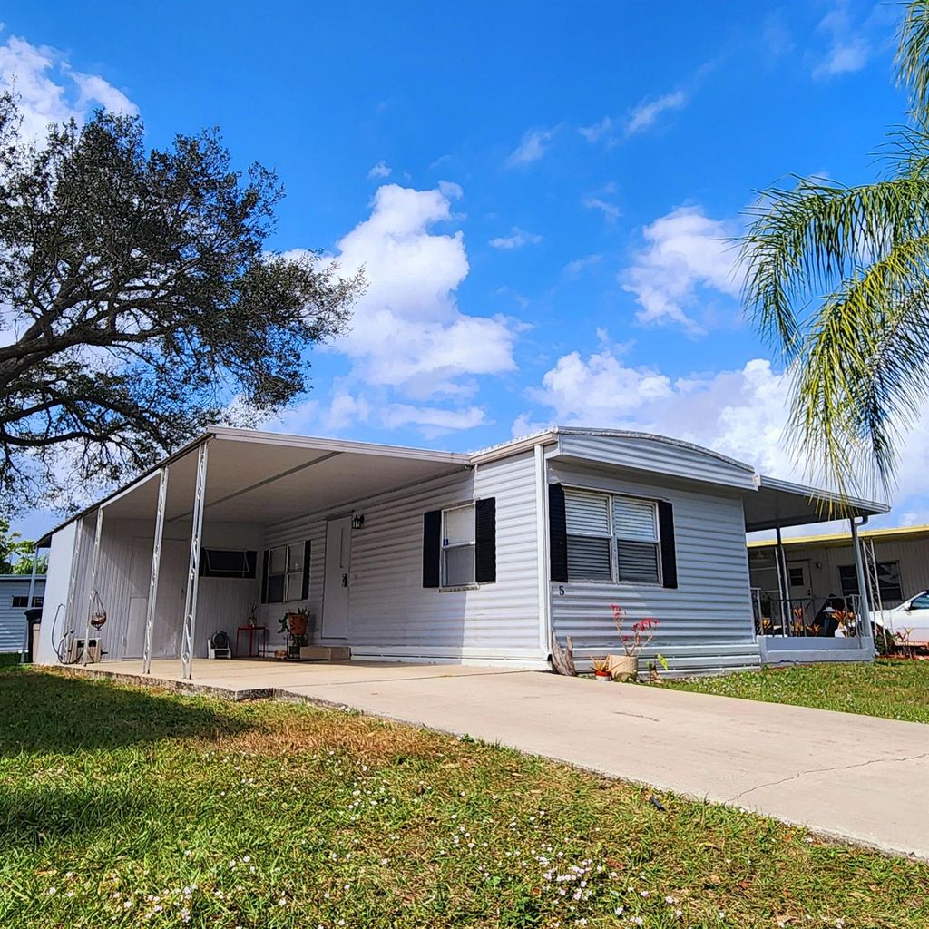 Photo of 5 Espanola Lane, Port Saint Lucie, FL 34952 (MLS # R11058400)