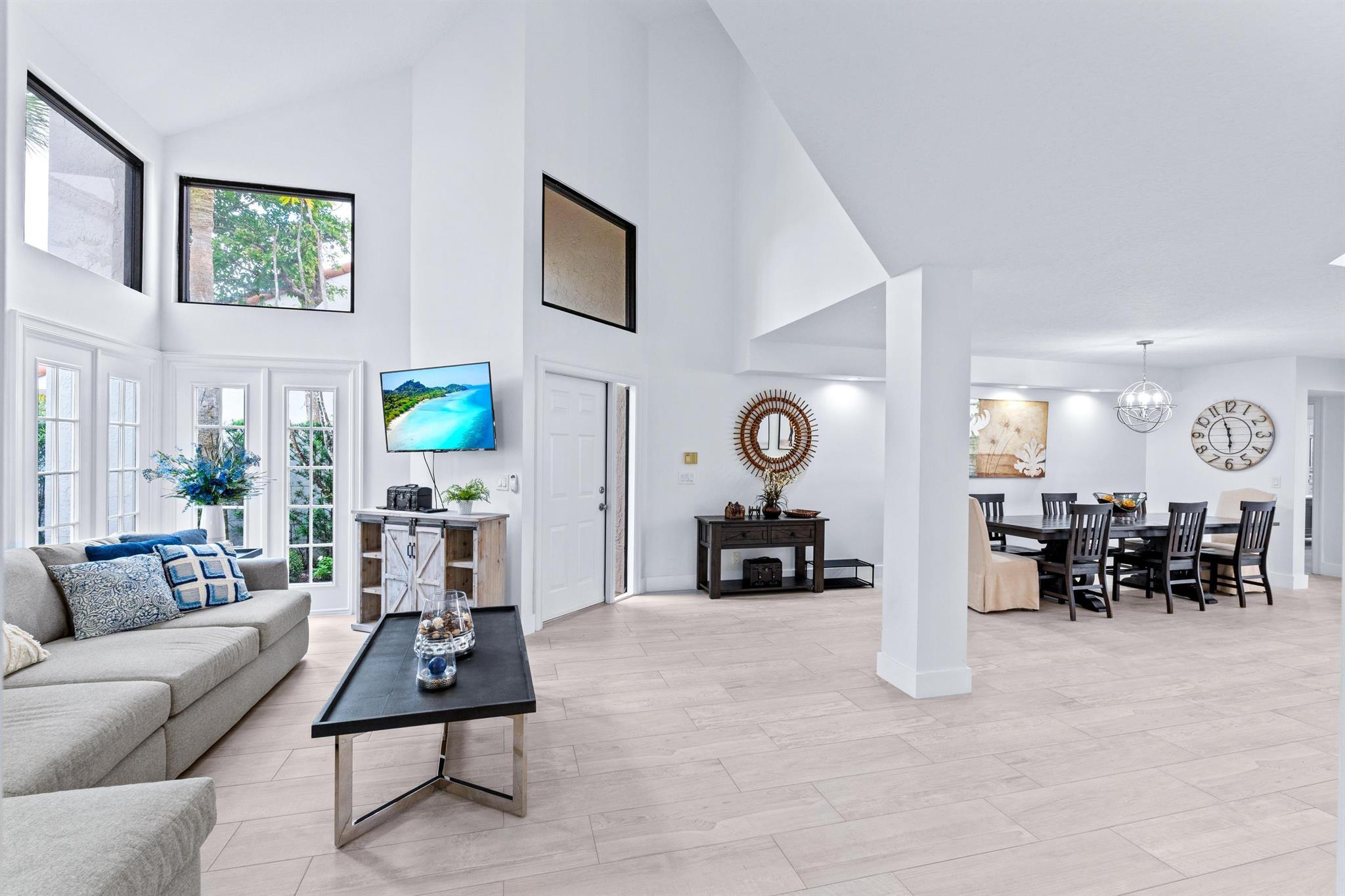 AVAILABLE STARTING JANUARY 2, 2026. Explore an exceptional opportunity with this 3-bedroom plus den/bonus room, 4.5-bath townhouse in the esteemed Palm Beach Polo & Country Club. Abundant natural light enhances the beauty of this spacious home and includes a well-appointed kitchen with stainless steel appliances. The primary bedroom serves as a luxurious retreat with an en-suite, soaking tub creating a tranquil escape. The property features an open-concept dining family area seamlessly connected to a patio overlooking the heated, inground, and screened pool surrounded by lush gardens. Positioned between the International Polo Club and Palm Beach International Equestrian Center, it provides unmatched access to Wellington's vibrant equestrian scene.
