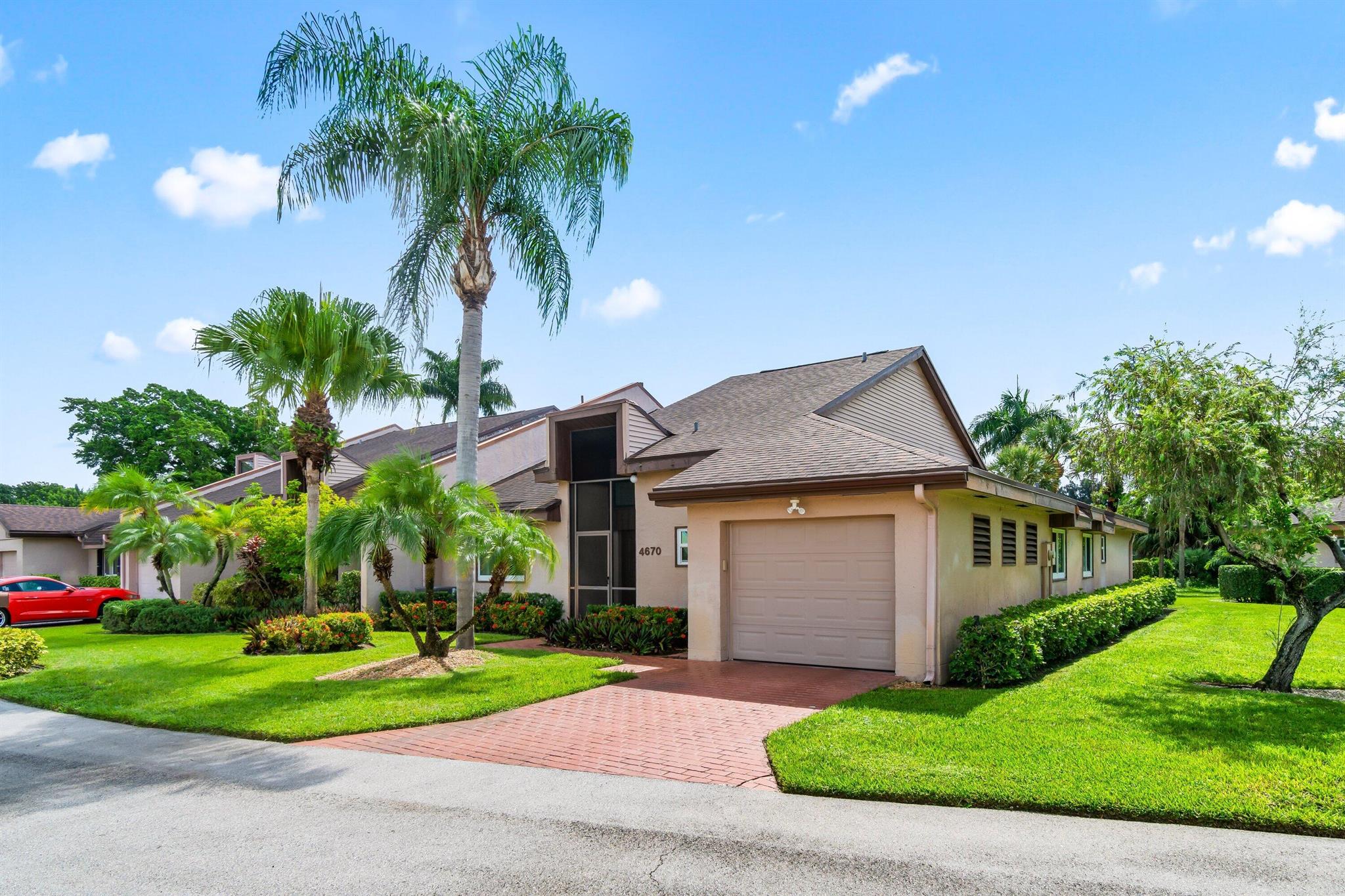 Discover modern elegance at 4670 Fountains Drive South in Lake Worth, FL. This 2,036-square-foot villa features 2 spacious bedrooms, a den and 2.5 bathrooms. The open kitchen, with top-notch LG appliances, a built in wine bar and quartz countertops, seamlessly integrates with the living area, perfect for hosting. Recent updates, including hurricane windows and doors, a new roof, Central Air system 2.5 years, updated high hats throughout provide peace of mind. Embrace a lifestyle of comfort and style in this vibrant community.Situated on a corner lot, this home boasts a private outdoor space and a screened lanai for tranquil enjoyment, a 1 car garage, and a community pool within in the Fountains. Membership to Country Club not mandatory but available. All ages are welcomed!