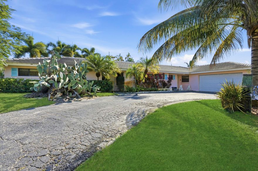 Prime Florida Living in this spacious 4-bedroom 3 full bathrooms pool home on the water. Watch sunrises with your coffee on your waterfront patio. Sit on the dock in the evenings watching manatees swim up for a visit.
Large pool patio for entertaining, side yard with pergola sitting area and dock for fishing, jet ski or boat. House has separate entrance to north wing for those that may need a mother-in-law suite.  
Granite countertop in kitchen, ceramic tile floors, full view sliding glass doors along back wall and entrances from east bedrooms to pool area.  5 mins from North Palm Beach Country Club, open to public with memberships available.
Bring your fabulous decorating ideas to this amazing large lot waterfront home with potential to be your personal Oasis.