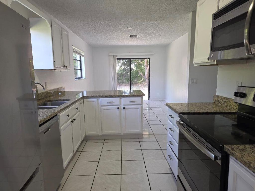 Photo of 1311 N Mangonia Drive, West Palm Beach, FL 33401 (MLS # R11121526)