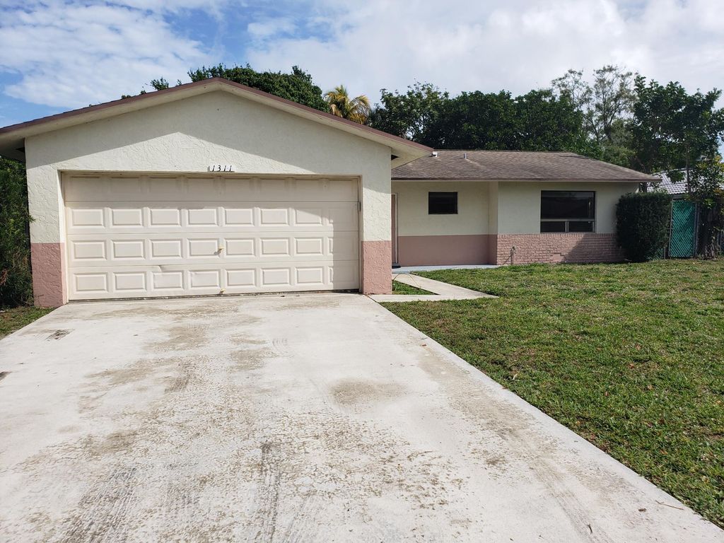 Photo of 1311 N Mangonia Drive, West Palm Beach, FL 33401 (MLS # R11121526)