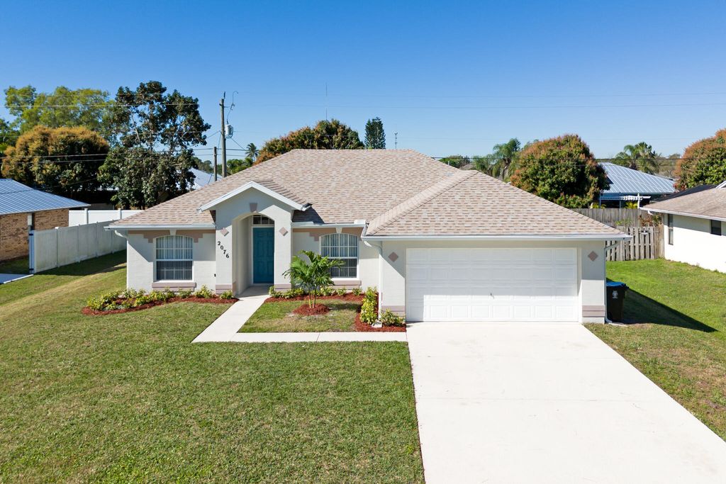 Photo of 2076 SE Camilo Street, Port Saint Lucie, FL 34952 (MLS # R10962434)