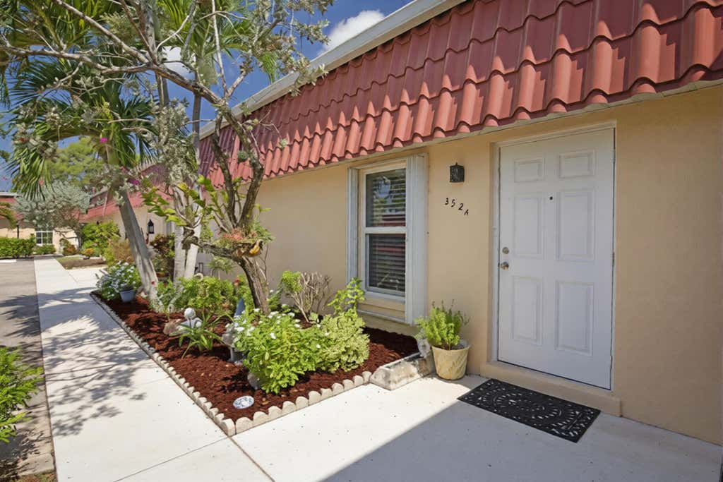 Photo of 352 Covered Bridge Boulevard #A, Greenacres, FL 33467 (MLS # B26060799)