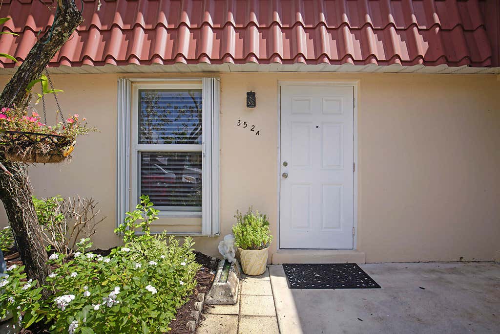 Photo of 352 Covered Bridge Boulevard #A, Greenacres, FL 33467 (MLS # B26060799)