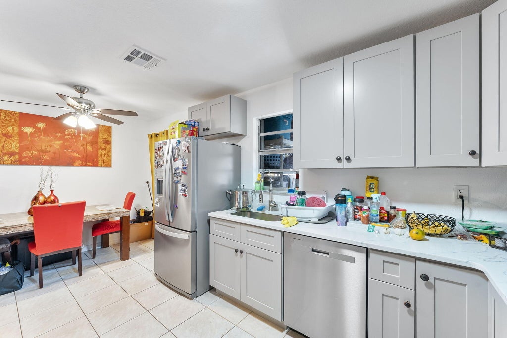 Photo of 5735 Kumquat Road, West Palm Beach, FL 33413 (MLS # B26053120)