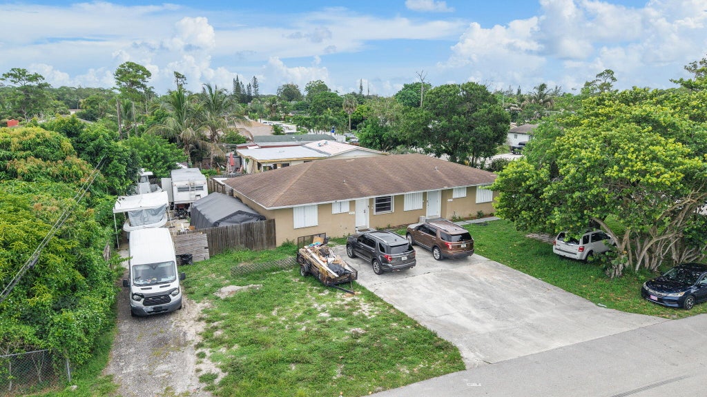 Photo of 5735 Kumquat Road, West Palm Beach, FL 33413 (MLS # B26053120)