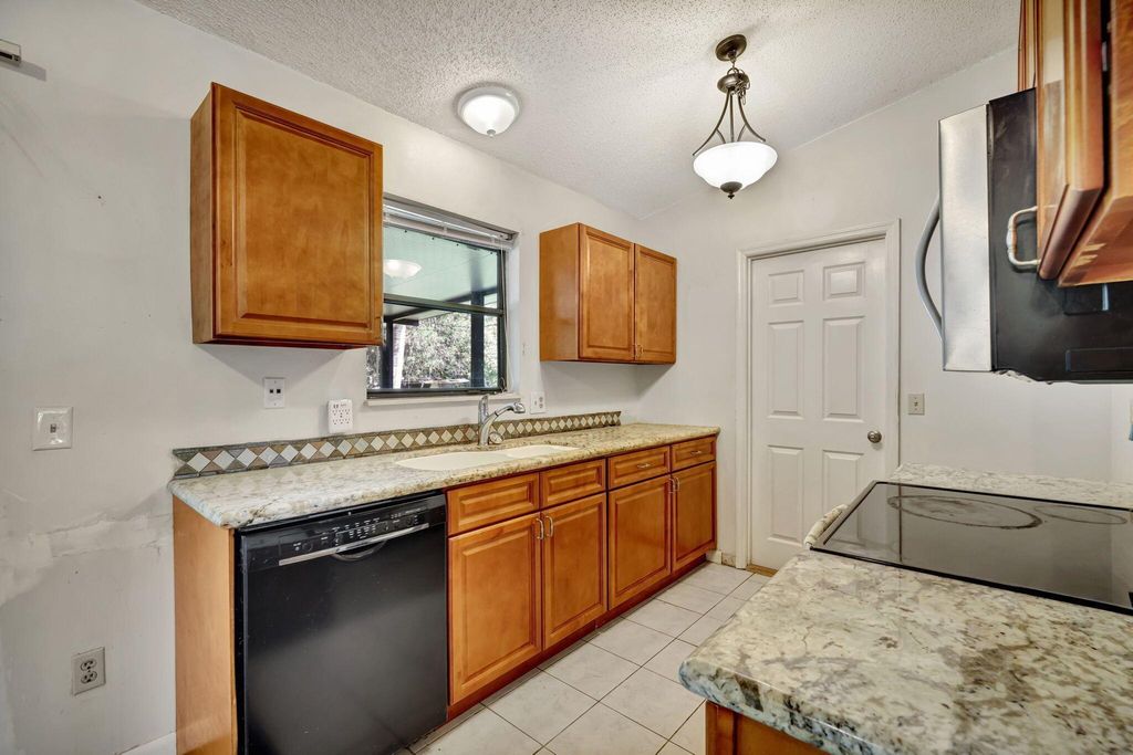 Photo of 7902 Holopaw Avenue, Fort Pierce, FL 34951 (MLS # R11132509)