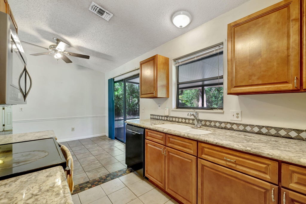 Photo of 7902 Holopaw Avenue, Fort Pierce, FL 34951 (MLS # R11132509)