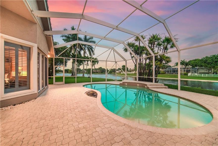 Rarely Available In Prestigious, 24-Hour Guard-Gated Fox Ridge! 5 Full Beds, 4 Baths, Waterfront Pool Dream Home, w/3-Car Garage On A Private Cul-De-Sac Lot. Take In 180 Degrees of Pristine Sunset Water Views Right In The Comfort Of Your Private Screened-In Patio/Pool Area Which Is Ideal For Entertaining! Popular Tri-Split Floor Plan, Spacious Primary Bed w/Sitting Area, Walk-In Closets, Large Kitchen w/Granite Counters w/Breakfast Area Overlooking Back Patio, Formal Dining & Living Area, Floor-Plan Ideal For A Large Family! Oversized Yard, All Beds Have Built-In Closets, Best Available Home For The Price In All Of Parkland! Your Kids Can Walk To All Parkland's A-Rated Schools, Guard Gated, Playground, Tennis Courts, Close To Major Shopping, Dining, & Highways, This Home Won't Last Long!