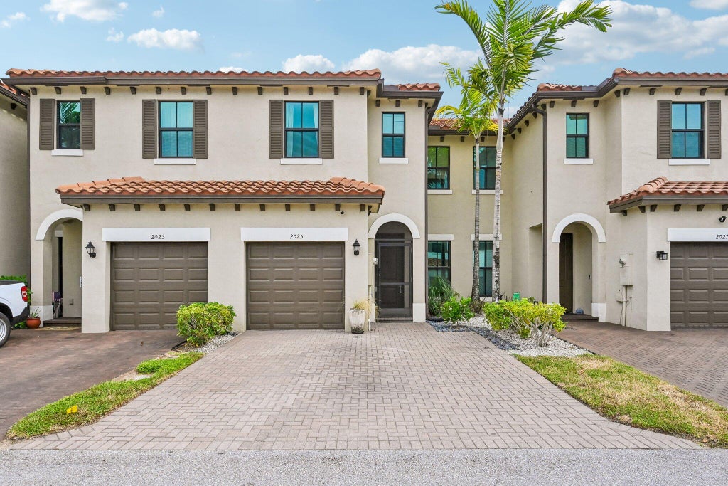Photo of 2025 OYSTERWOOD Lane, Riviera Beach, FL 33410 (MLS # B26070034)