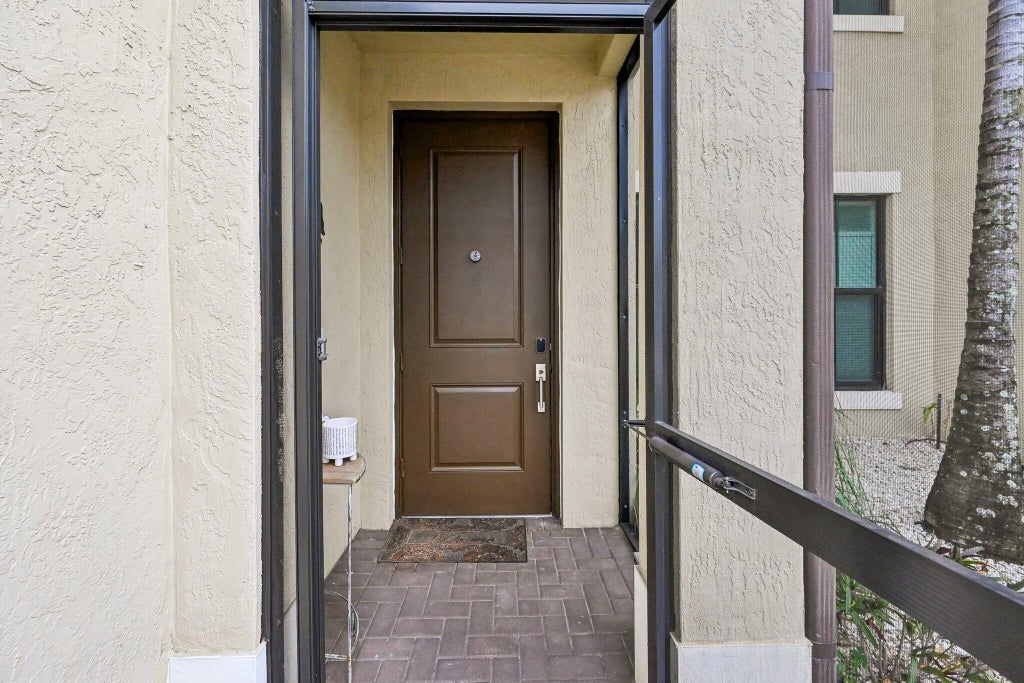 Photo of 2025 OYSTERWOOD Lane, Riviera Beach, FL 33410 (MLS # B26070034)