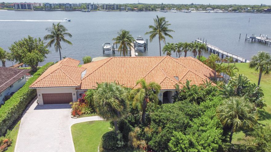 Welcome to 901 Lands Ends Road, your new piece of Florida paradise! Where coastal luxury meets exclusivity and privacy, this property is nestled on Palm Beach's coveted Hypoluxo Island and offers awe-inspiring elegance and unparalleled waterfront views! Prepare to be captivated as you step through the grand double doors, revealing breaktaking panoramic wide-water views and natural light throughout this massive 4,000 plus square foot home. A true masterpiece, this property boasts an expansive floor plan with 5 Bedrooms and 4 Bathrooms, complete with a movie theater, gourmet outdoor kitchen, and a full cabana/boater's bathroom in the garage. Even more impressive than the house is the property and location! With multiple outdoor entertaining areas and an extra long dock that can accomodate 2 or more boats with both 12,000 lb and 21,000 lb lifts, there's plenty of room for toys and activities! These types of opportunities don't come often, so call me for a tour today!