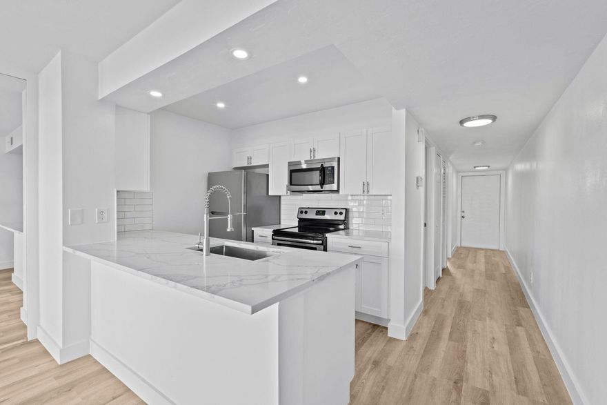 Renovated top floor Key West style condo in the highly sought after Cypress Point at PGA National. This light filled one bed, one bath residence offers a modern aesthetic featuring a brand new kitchen with quartz countertops, updated bathroom with quartz finishes, all new flooring, fresh paint, and new refrigerator, dishwasher, plus new washer & dryer in unit.
Enjoy serene lake views from the covered balcony perfect for morning coffee or evening sunsets. The community offers a pool, laundry facility, and one assigned parking space. In the gated community, enjoy scenic walking trails and two nearby parks PGA National Park and Master's Park. Ideally situated just minutes from championship golf, dining and shopping, Downtown Palm Beach Gardens, beaches, and PBI airport. All information provided by the broker and its representatives, including but not limited to pricing, square footage, calculations, and statistics, is deemed reliable but not guaranteed and is subject to errors, omissions, or changes without notice. Buyers and their representatives must independently verify all details.