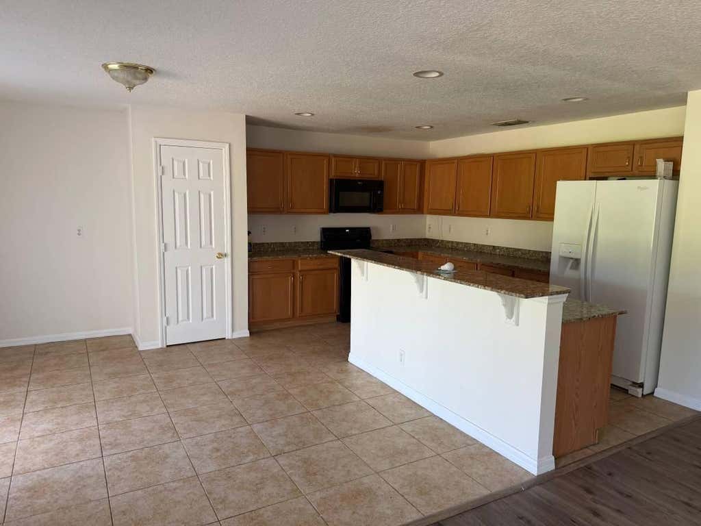 Photo of 3691 SW MARGELA Street, Port Saint Lucie, FL 34953 (MLS # B26060737)