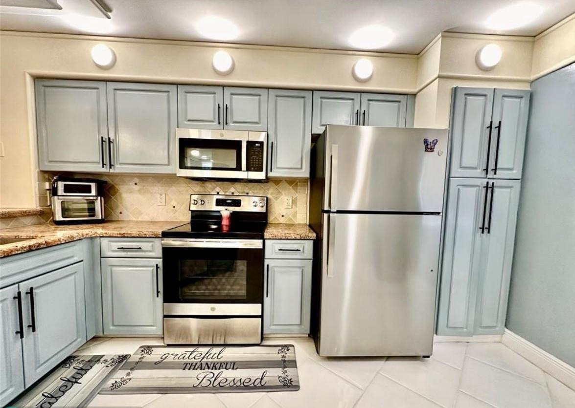 Experience peaceful living in this beautiful corner unit. Enjoy serene water and fountain views from your screened-in balcony. This immaculate condo features a spotless, updated kitchen with new appliances and granite countertops. The living areas boast beautiful tile floors, while the bedrooms offer soft carpet. Highlights include new molding, no popcorn ceilings, new light fixtures, ceiling fans. Easy access to I-95 and the Turnpike for easy commuting. Minutes from beaches, golf courses, Harrah's Casino, Top Golf, the new Pomp, and the vibrant Las Olas Boulevard. The community itself offers a full suite of amenities, including two pools, tennis and pickleball courts, billiards, fitness rooms, available membership to the Protective, walking trail around entire Cypress Bend, and more.