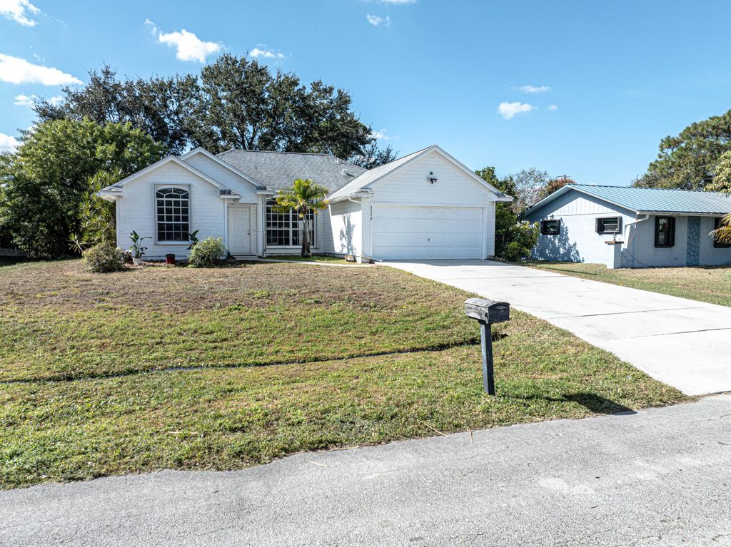 Photo of 1116 SE Puritan Lane, Port Saint Lucie, FL 34983 (MLS # R11151987)