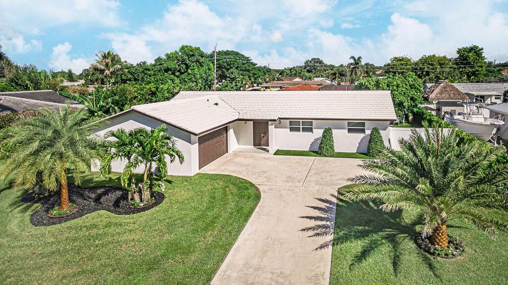 Photo of 1881 Caribbean Road W, Lake Clarke Shores, FL 33406 (MLS # R11133516)
