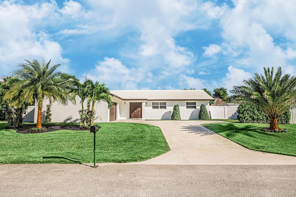 Photo of 1881 Caribbean Road W, Lake Clarke Shores, FL 33406 (MLS # R11133516)