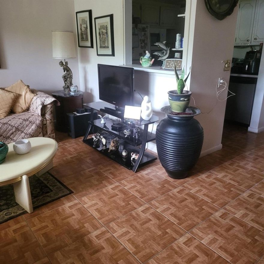 No Rental Restrictions!!!!!   Beautiful Furnished Apartment on the Ground Floor.  NO STAIRS  with Nice Garden View from your very own Enclosed Patio.    Very Clean Building which allows Rentals.   Community is registered as a 55+ community.  Windows in front of unit are Impact Windows.