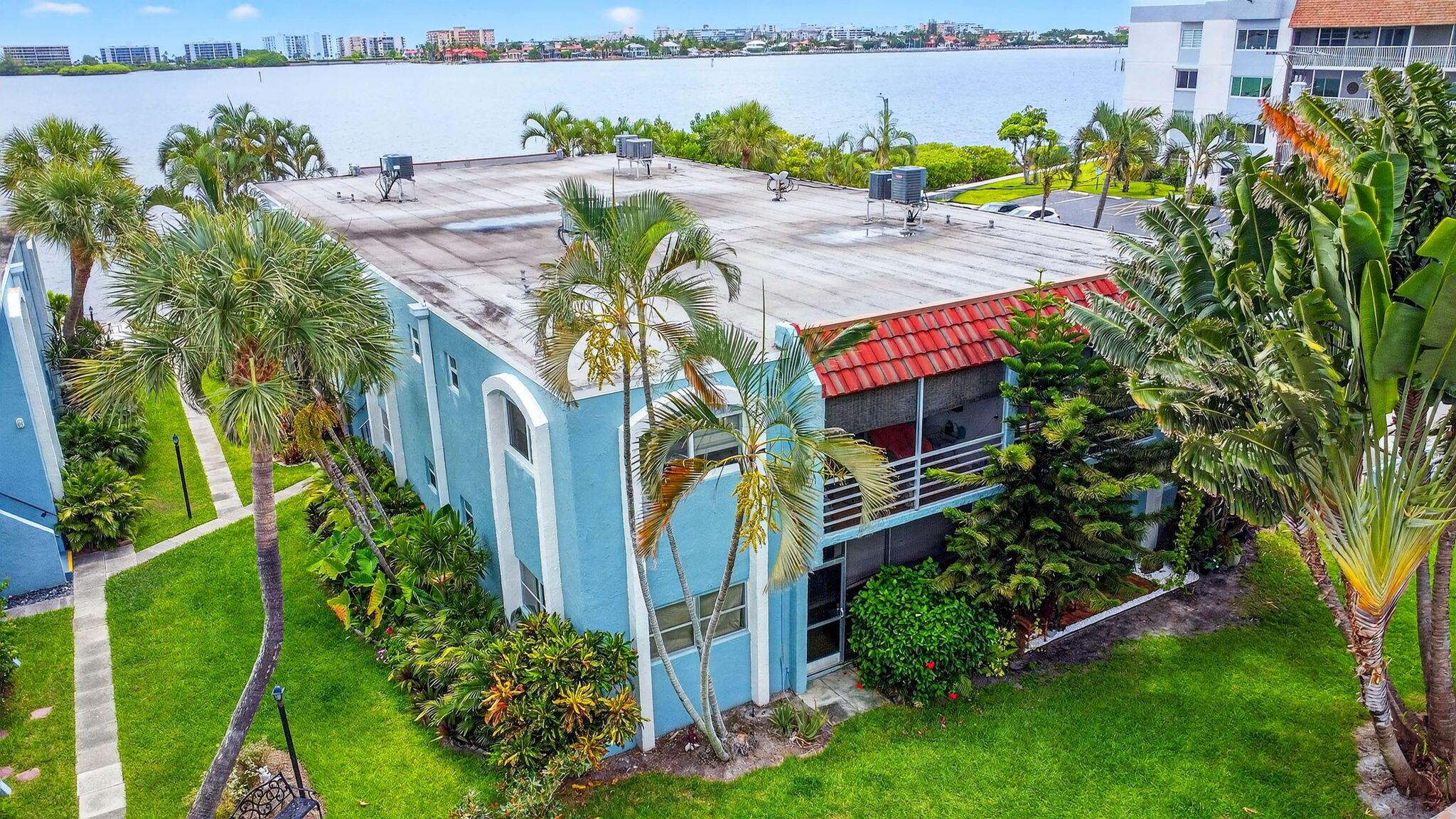 Discover Ken-Lee Gardens--an Intracoastal waterfront community offering resort-style living in Lake Worth Beach. This rarely available 2BR/2BA first-floor home boasts spacious rooms, a walk-in closet, and a bright kitchen with plentiful cabinetry and sunny breakfast area. The open dining/living layout flows to a screened patio with generous storage--just steps from the water. Enjoy a private sandy beach for kayaking, fishing, and dolphin watching, plus a heated pool, clubhouse, BBQ area, and lush tropical landscaping. Pet-friendly, all-age community with on-site management, assigned parking, and a one-year ownership requirement before renting. Quick access to downtown, I-95, and the beach.