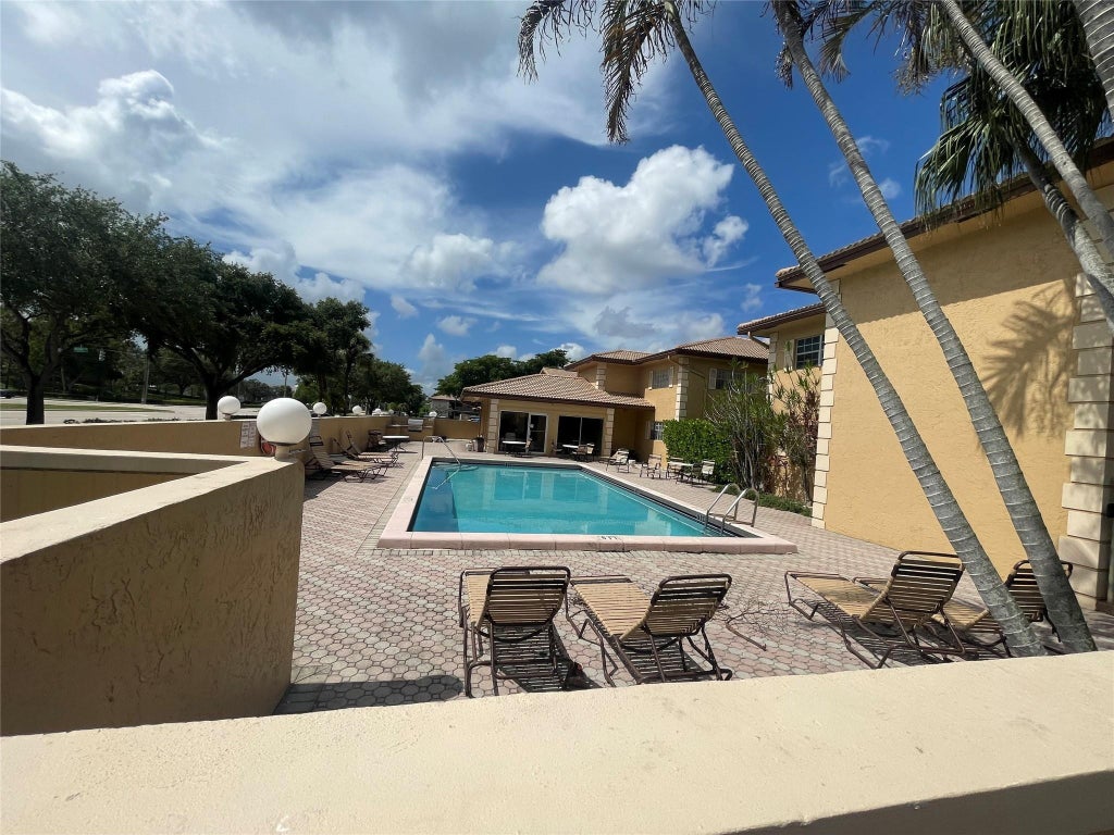 Photo of 3026 Coral Springs Drive #106-3, Coral Springs, FL 33065 (MLS # F10515828)