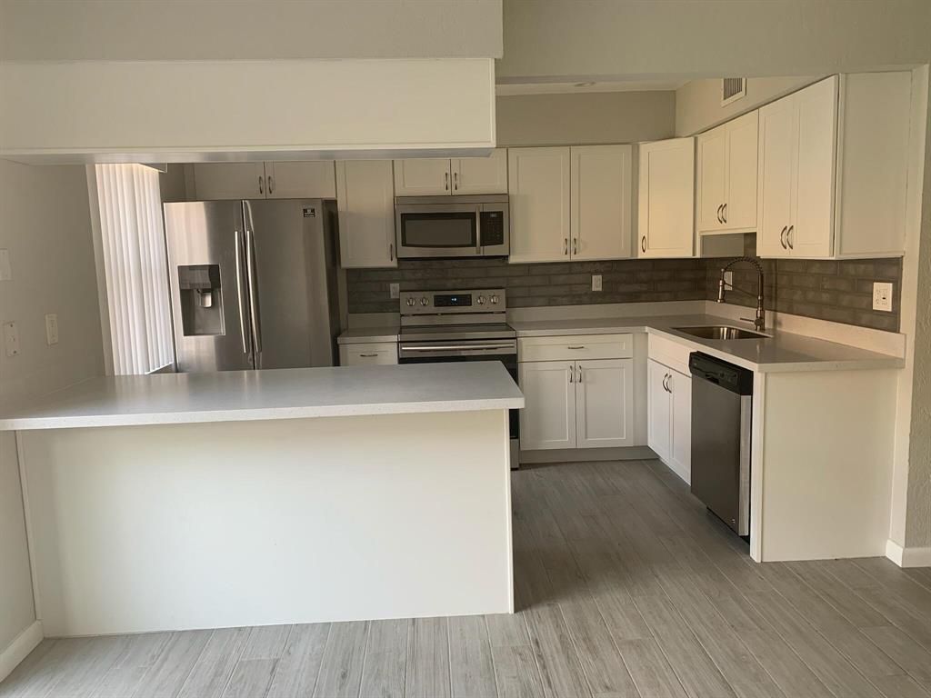 Photo of 822 Sandtree Drive, Palm Beach Gardens, FL 33403 (MLS # R10749332)