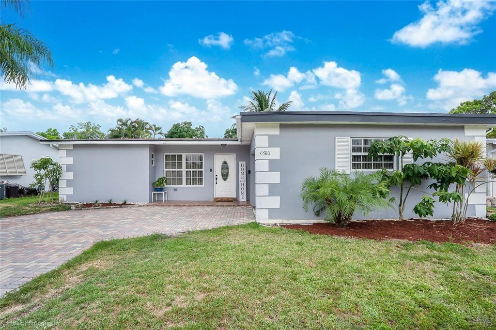 Welcome to your next home in Sunrise! This spacious 3BR/2BA gem features an added garage conversion with a private entrance—perfect for guests or extended family. Inside, enjoy tile floors, a modern kitchen, central A/C, and in-unit laundry. Step outside to a fully fenced backyard backing to a peaceful canal—ideal for relaxing evenings. Located in a quiet, family-friendly neighborhood near top-rated schools, shopping centers, parks, and dining. Quick access to major highways. No HOA. Available early August. First, last & security required.