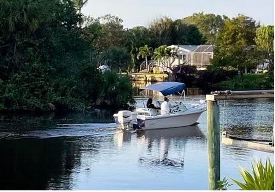 COMING SOON. 1ST SHOWINGS 3/29 AT 1PM. OCEAN ACCESS - DIRECT FRONTAGE ON SOUTH FORK OF ST LUCIE RIVER. PRESERVE across river - very private. 2014 Modular Home with 3- bedrooms/2 baths + Office or 4th Bedroom. Granite Countertops, Crown Molding throughout, brand new refrigerator, Large Garage with 2" x 6" Construction & 10' ceilings, Trex Boat Dock, Room for Pool. Fixed Bridge Accommodates a 20'+/- Boat. $25/mo. HOA. No leasing 1st 2 years, no short-term rentals, 1 dog under 35 lbs., non-aggressive breed. No fences. Free Space in Community Storage Area for Boat or Motorhome. Original Owner All components were installed in 2014