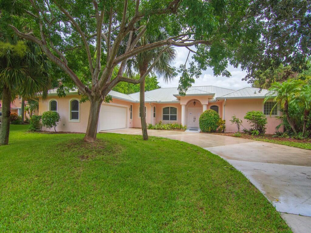 Beautifully maintained pool home located in the sought-after Twelve Oaks HOA. This residence offers a split floor plan with cathedral ceilings, featuring real wood flooring throughout. The spacious kitchen provides ample storage with wood cabinetry and granite countertops, perfect for the home chef.Enjoy multiple living areas including a formal dining room, family room, and living room, ideal for entertaining and everyday living. The primary suite is a retreat, offering two walk-in cedar closets, large glass sliding doors overlooking the pool, dual vanity sinks, and a luxurious jetted tub.Outdoor living is enhanced with a summer kitchen, cabana bath, pool equipment storage, and a screened pool area--perfect for relaxing or entertaining. Additional features include a large laundry