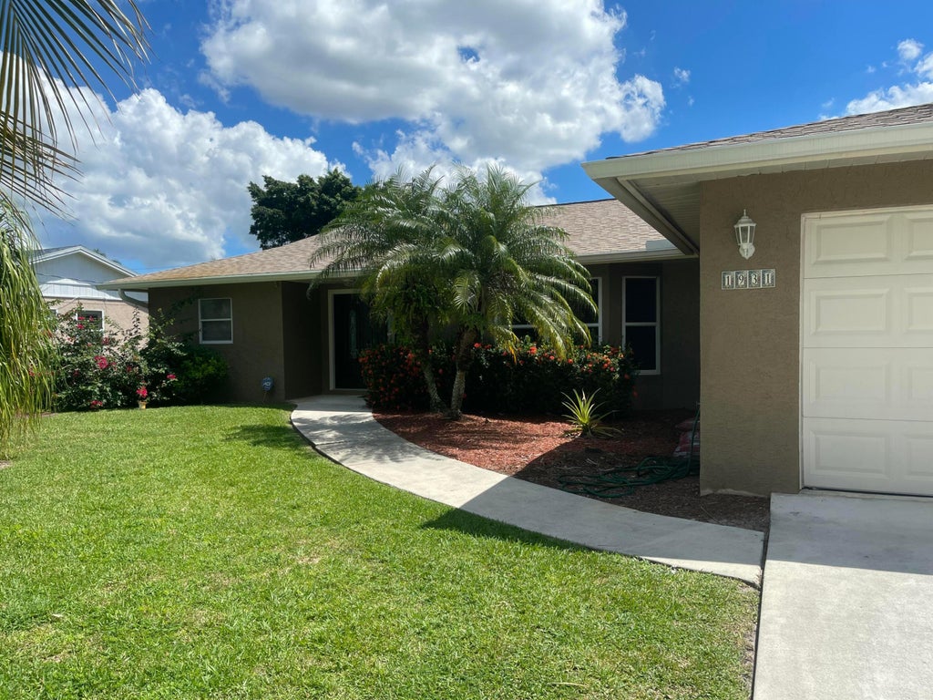 Photo of 1931 SW Brisbane Street, Port Saint Lucie, FL 34984 (MLS # R11116321)