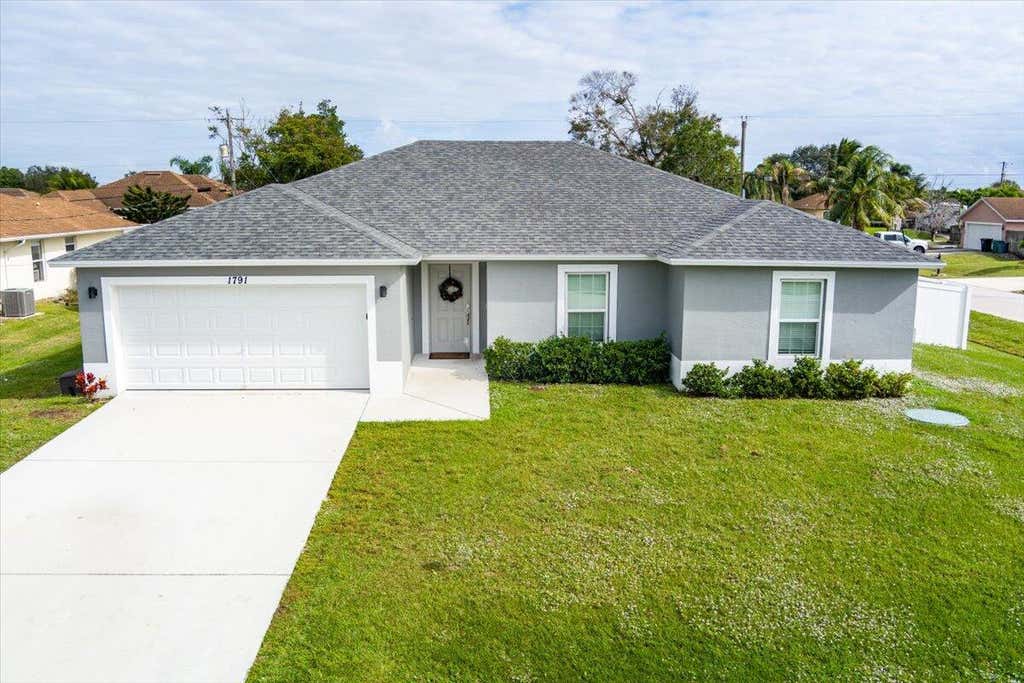 Photo of 1791 SW Gloria Lane, Port Saint Lucie, FL 34953 (MLS # R10945375)