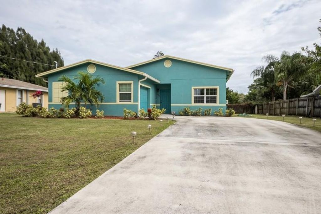 Photo of 735 SW Curtis Street, Port Saint Lucie, FL 34983 (MLS # R10676852)