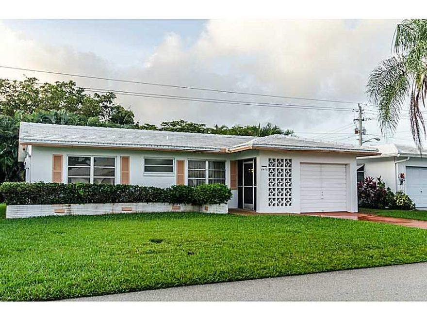 FANTASTIC 2/2 HOME IN THE MAINLANDS OF TAMARAC! THIS PROPERTY IS IN GREAT CONDITION WITH TILE FLOORS THROUGHT MAIN LIVING AREAS AND CARPET IN THE BEDROOMS. PROPERTY ALSO FEATURES  FLORIDA ROOM AND HAS A BEAUTIFUL BACK YARD. IT IS ALSO DIRECTLY ACROSS THE  STREET FROM THE CLUBHOUSE AND POOL. THIS IS AN 55+ AGE RESTRICTED COMMUNITY AS PER ASSOCIATION. HURRY THIS UNIT IS PRICED TO SELL! NO CHILDREN UNDER THE AGE OF 18. 1 SMALL DOG UNDER 30 POUNDS.