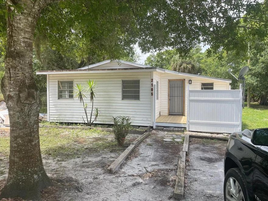 MOVE IN READY! Situated on a DOUBLE LOT! Beautifully renovated! This charming 3-bedroom, 1-bathroom home strikes the ideal balance between elegance and practicality. It features a recently installed roof (2023), a new bathroom, modern kitchen with granite countertops, new central AC (2022), impact windows, stylish light fixtures, an in-house washer and dryer, and a new water filtration system, saving you from water bills. Property offers ample space for family gatherings and various activities. Financing friendly and cash friendly