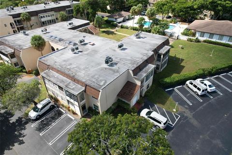 Photo of 2820 Riverside Drive #201-2, Coral Springs, FL 33065 (MLS # B26019773)