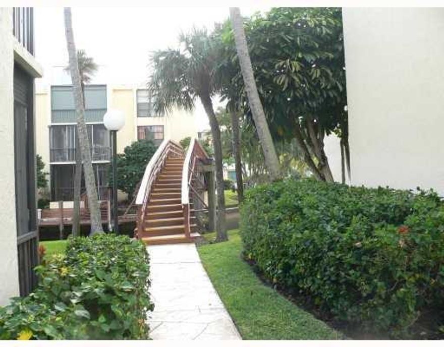 NEW TILE & NEW CARPET IN BEDROOMS AND NEW PAINT! BOATING COMMUNITY WITH EXCLUSIVE YACHT CLUB, TENNIS COURT 5 POOLS, PUTTING GREEN, CLUBHOUSE AND BOAT DOCKAGE AVAILABLE, SECURED GATED COMMUNITY, 2 MINUTES TO DESIRABLE DEERFIELD OR WALK THE BOARDWALK AT MIZNER, RIGHT IN THE MIDDLE OF EVERYTHING WITH VENICE LIKE WATER VIEWS, RELAX ON THE BALCONY OVERLOOKING BOATS AND BREATHTAKING WATERVIEWS.  BOCA BAYOU MAKES YOU FEEL SO AT HOME THAT YOU WILL WANT 2 BUY AFTER LIVING THERE.