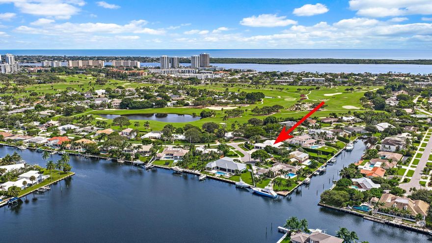 One of the finest lots in all of North Palm Beach...A HUGE yard, 75' of water frontage, 55'dock, 16k lb boat lift, NO fixed bridges - All located only minutes to North Palm Beach Country Club! Enjoy luxury living on this extremely rare .64 acre waterfront property in the Village of North Palm Beach. This impeccable property presents endless possibilities with the current residence boasting 3,630 sq ft of living space and 5,023 total sq ft, featuring 5 bedrooms, 1 or 2 offices, TV room and a spacious open-concept kitchen and great room that overlook the sparkling swimming pool and vast backyard, complete with mature, lush hedges for ultimate privacy.Move in, renovate, or design and build your own dream custom estate, this unique lot offers a canvas for creating your ideal home.  The...